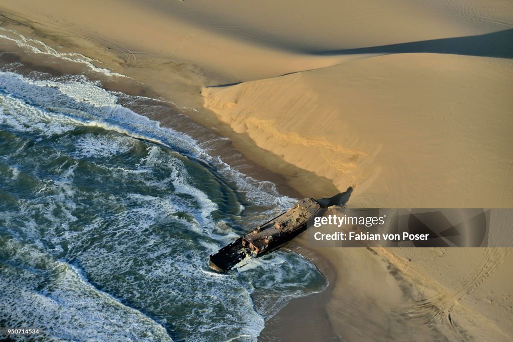 Wreck of the Shaunee, shipwrecked in 1976, Namibian coast near Conception Bay, south of Sandwich Harbour, aerial view, Namib-Naukluft National Park, Namibia