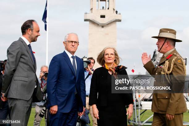 Australian Colonel Scott Clingan escorts French Prime Minister Edouard Philippe and Australian Prime Minister Malcolm Turnbull and his wife Lucy...