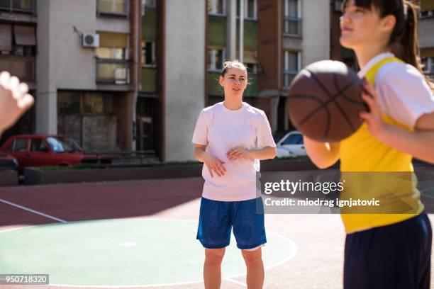 catch it - woman yellow basketball stock pictures, royalty-free photos & images