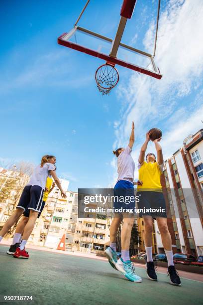 basketball relaxation on the street - woman yellow basketball stock pictures, royalty-free photos & images