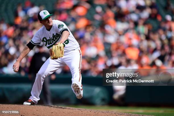 Brad Brach of the Baltimore Orioles throws a pitch in the ninth inning against the Cleveland Indians at Oriole Park at Camden Yards on April 22, 2018...