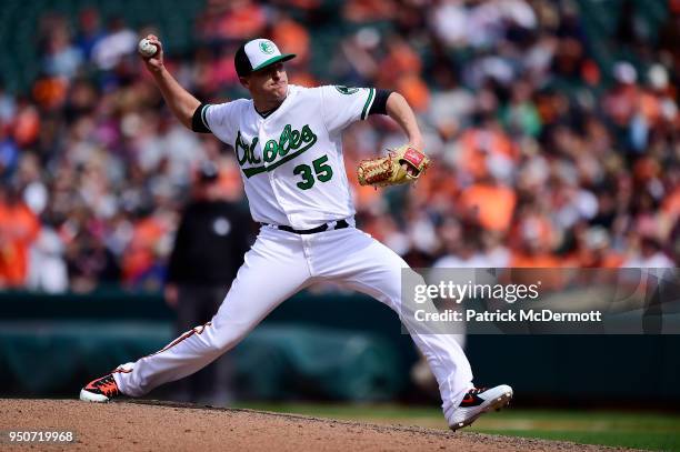 Brad Brach of the Baltimore Orioles throws a pitch in the ninth inning against the Cleveland Indians at Oriole Park at Camden Yards on April 22, 2018...