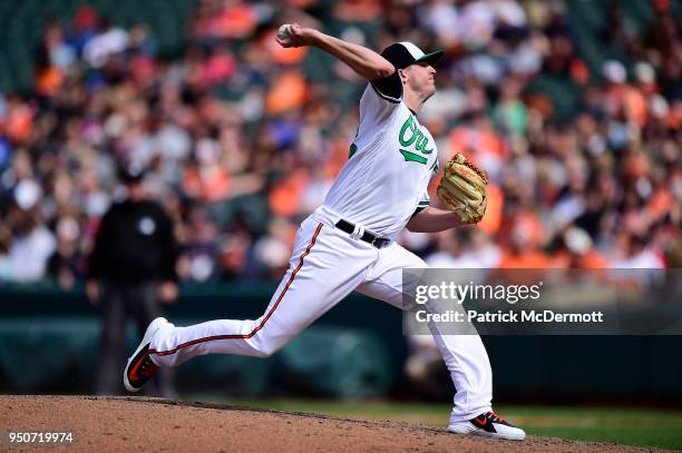 Brad Brach of the Baltimore Orioles throws a pitch in the ninth inning against the Cleveland Indians at Oriole Park at Camden Yards on April 22, 2018...