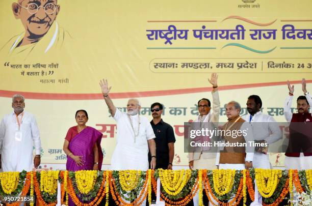 Prime Minister Narendra Modi along with Madhya Pradesh chief minister Shivraj Singh during the occasion of National Panchayati Raj Day, in Mandla, on...