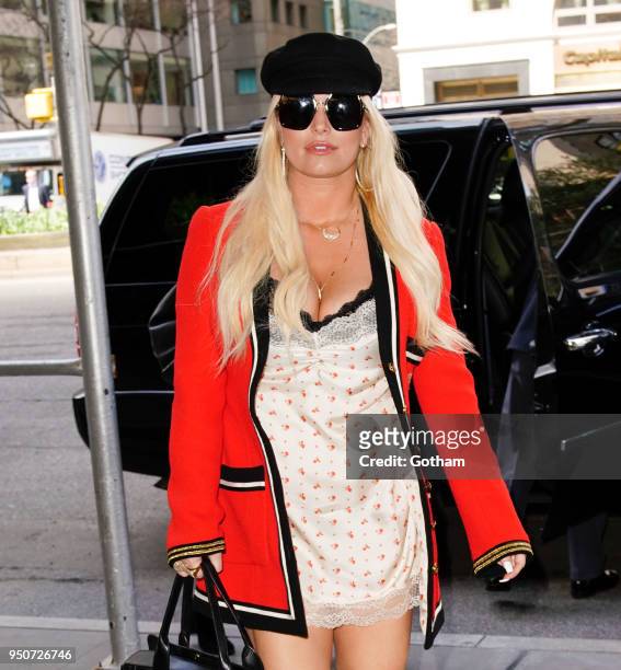 Jessica Simpson wears a nightie under a military-inspired Gucci jacket on April 24, 2018 in New York City.