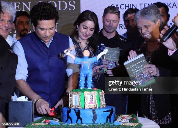 Former Indian Cricketer Sachin Tendulkar along with his wife Anjali, and former Australian cricketer Michael Clarke during a launch of a book "Eleven...