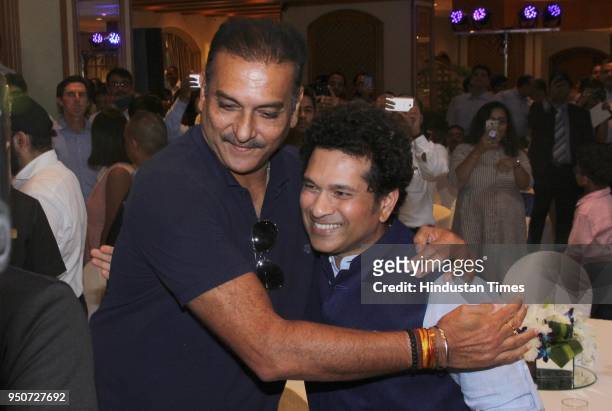 Former Indian Cricketer Sachin Tendulkar and Indian team coach Ravi Shashtri during a launch of a book "Eleven Gods And A Billion Indians" authored...