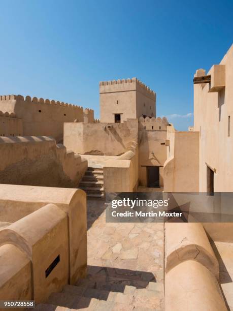 courtyard, nakhal fort or husn al heem, fortress above nakhl oasis on jebel nakhl massif, historical loam construction, al batinah, oman - loam fotografías e imágenes de stock