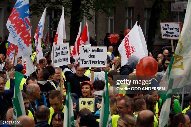 Amazon employees protest against Amazon CEO Jeff Bezos before he arrives at the headquarters of publisher Axel-Springer where he will receive the...