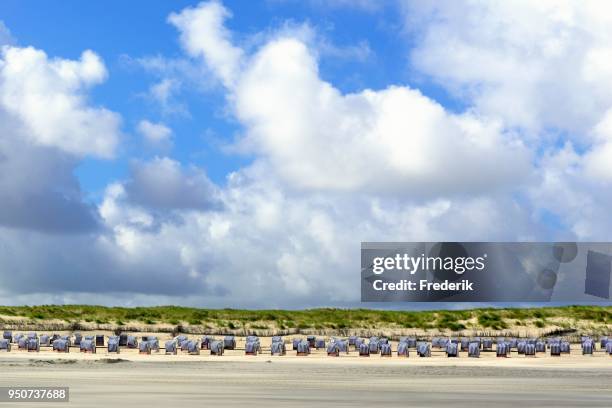 blue-white beach chairs on the east beach white dune with cloudy skies, norderney, east frisian islands, north sea, lower saxony, germany - norderney imagens e fotografias de stock