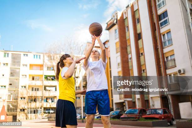 basketball relaxation outdoors - woman yellow basketball stock pictures, royalty-free photos & images