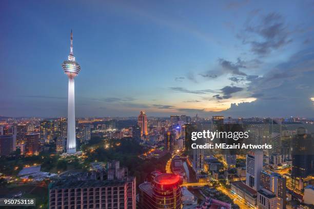 kl tower in blue hour dusk - menara kuala lumpur tower stock pictures, royalty-free photos & images