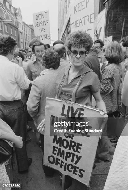 South African actress Janet Suzman at a demonstration in favor of the live theater industry, London, UK, 11th July 1977. She is holding a placard...