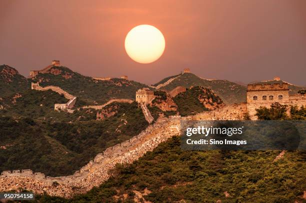 sunset over jinshanling section of the great wall, chengde, hebei, china - chengde stock pictures, royalty-free photos & images