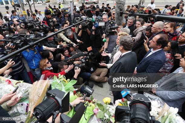 Ontario Premier Kathleen Wynne and Toronto Mayor John Tory speak to reporters after leaving flowers on April 24, 2018 at a makeshift memorial for...