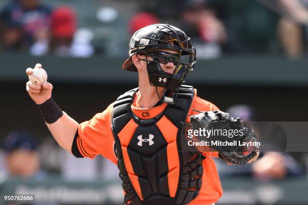 Chance Sisco of the Baltimore Orioles throws to second base during a baseball game against the Cleveland Indians at Oriole Park at Camden Yards on...