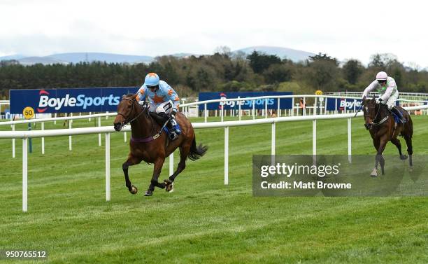 Naas , Ireland - 24 April 2018; Un De Sceaux with Patrick Mullins up, on their way to winning the BoyleSports Champion Steeplechase from second place...