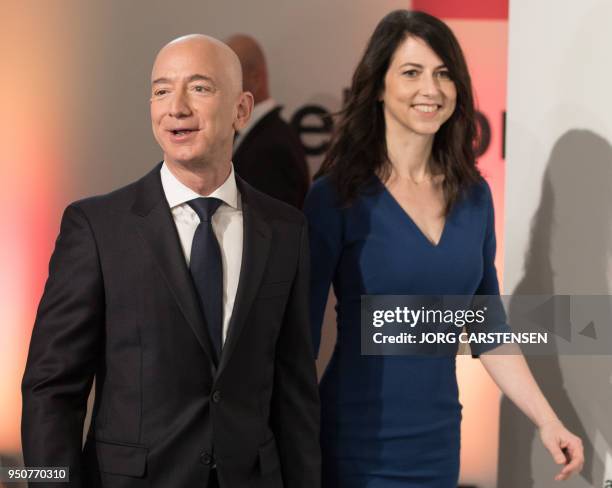 Amazon CEO Jeff Bezos and his wife MacKenzie Bezos arrive at the headquarters of publisher Axel-Springer where he will receive the Axel Springer...