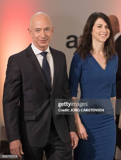 Amazon CEO Jeff Bezos and his wife MacKenzie Bezos arrive at the headquarters of publisher Axel-Springer where he will receive the Axel Springer...