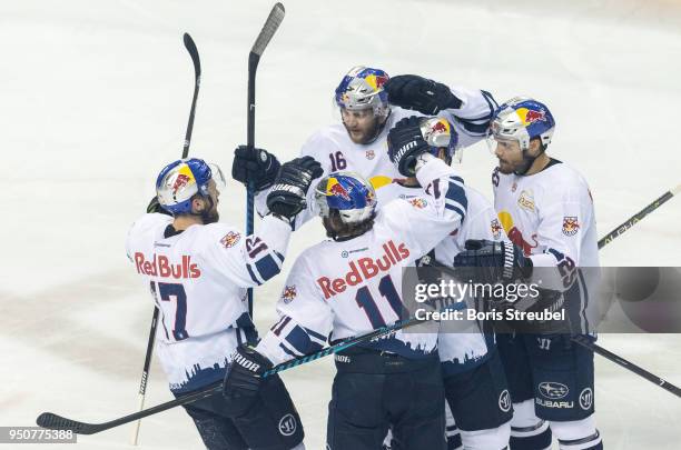 Konrad Abeltshauser of Red Bull Muenchen celebrates with team mates after scoring his team's first goal during the DEL Playoff final match 6 between...