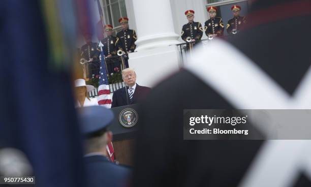 United States President Donald Trump speaks at an arrival ceremony during a state visit with Emmanuel Macron, France's president, not pictured, on...