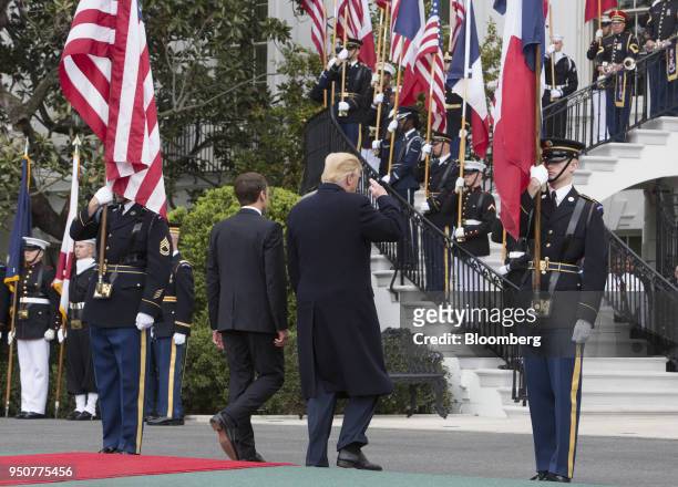 President Donald Trump, center right, and Emmanuel Macron, France's president, center left, depart from the podium after speaking at an arrival...
