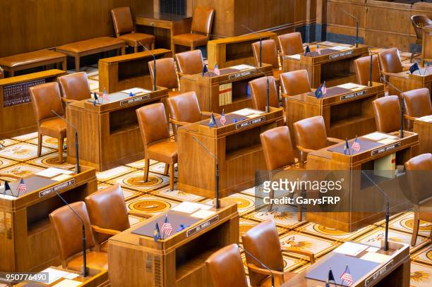 oregon senate chamber at state capitol desk front chairs flags - metal nameplate stock pictures, royalty-free photos & images