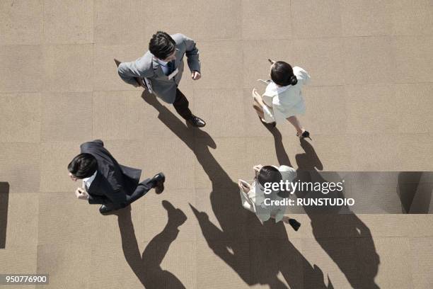 business people walking, overhead view - overhead view people walking stock pictures, royalty-free photos & images