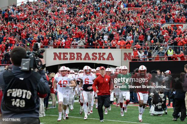 Head Coach Scott Frost of the Nebraska Cornhuskers leads the team on the field before the Spring game at Memorial Stadium on April 21, 2018 in...