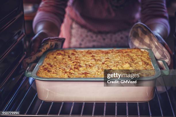 baking traditional shepard`s pie in the oven - oven stock pictures, royalty-free photos & images