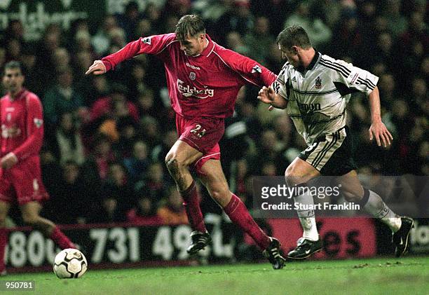 Igor Biscan of Liverpool races clear of Lee Clark of Fulham during the Worthington Cup fifth round match played at Anfield, in Liverpool, England....