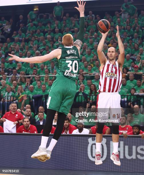 Kim Tillie, #14 of Olympiacos Piraeus competes with Aaron White, #30 of Zalgiris Kaunas in action during the Turkish Airlines Euroleague Play Offs...