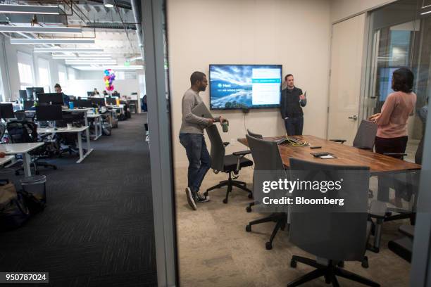 Employees stand inside a conference room at the Mapbox Inc. Headquarters in San Francisco, California, U.S., on Monday, March 5, 2018. Mapbox is a...