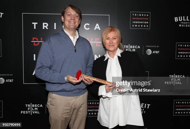 Co-founder and CEO, Columbia Care Nicholas Vita and Actress, Co-founder, Hopeland, Deborra-Lee Furness pose in an award room at Tribeca Disruptive...