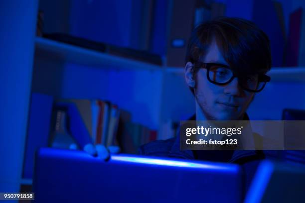 computer hacker or programmer commits cyber attack using laptop. - web programmer stock pictures, royalty-free photos & images