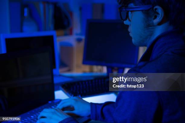 computer hacker or programmer commits cyber attack using laptop. - web programmer stock pictures, royalty-free photos & images