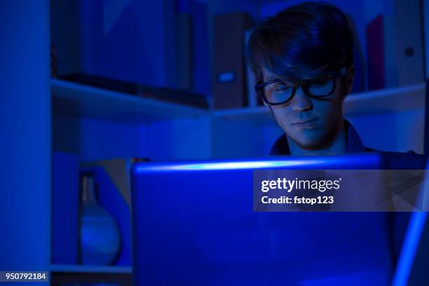 computer hacker or programmer commits cyber attack using laptop. - web programmer stock pictures, royalty-free photos & images