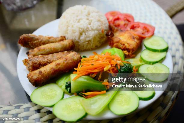 vietnamese food, spring rolls, veggies, cucumbers and steamed rice - vietnamese food stock pictures, royalty-free photos & images