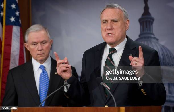 Senate Minority Whip Jon Kyl of Arizona speaks alongside Republican Senator Jeff Sessions of Alabama during a press conference on the pending health...