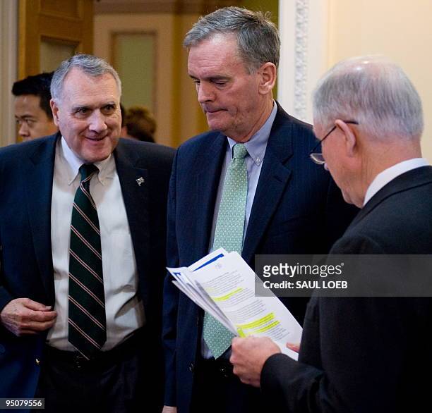 Republican Senator Jeff Sessions of Alabama looks over his paperwork alongside Senate Minority Whip Jon Kyl of Arizona and Republican Senator Judd...