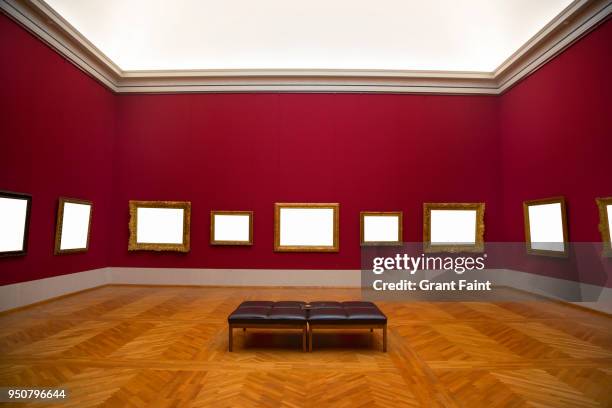 blank frames hanging on art gallery wall. - museo interior fotografías e imágenes de stock