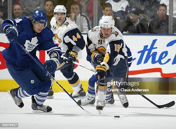 Tim Connolly of the Buffalo Sabres battles for puck posession with Mikhail Grabovski of the Toronto Maple Leafs in a game on December 21, 2009 at the...