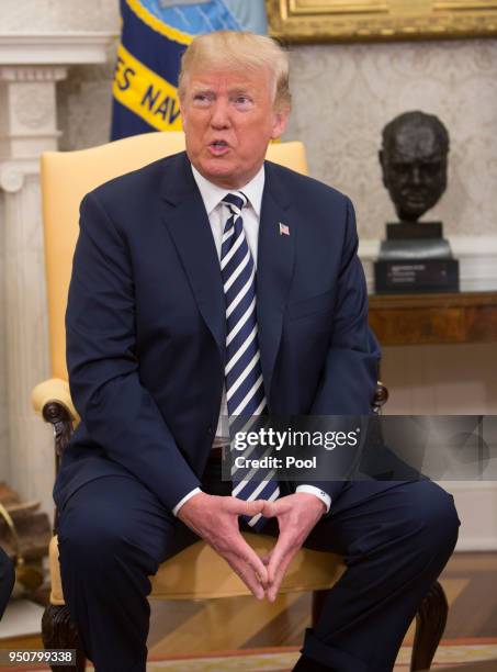 President Donald Trump speaks to the media during a meeting with President Emmanuel Macron of France April 24, 2018 in the Oval Office at the White...