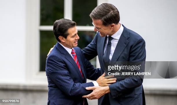 Mexican President Enrique Pena Nieto is welcomed by Dutch Prime Minister Mark Rutte for a working dinner with the the Dutch minister of...