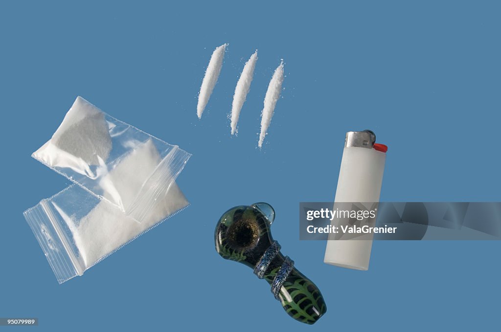 Drug paraphernalia on blue glass.