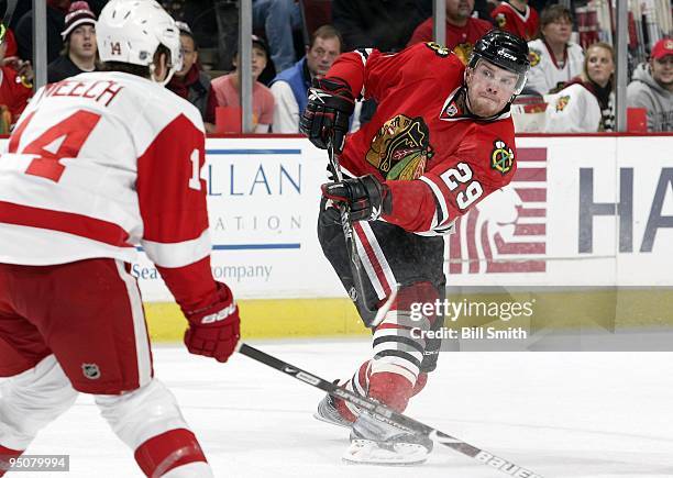 Bryan Bickell of the Chicago Blackhawks shoots the puck during a game against the Detroit Red Wings on December 20, 2009 at the United Center in...
