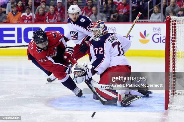 Devante Smith-Pelly of the Washington Capitals and Sergei Bobrovsky of the Columbus Blue Jackets collide in the third period in Game Five of the...