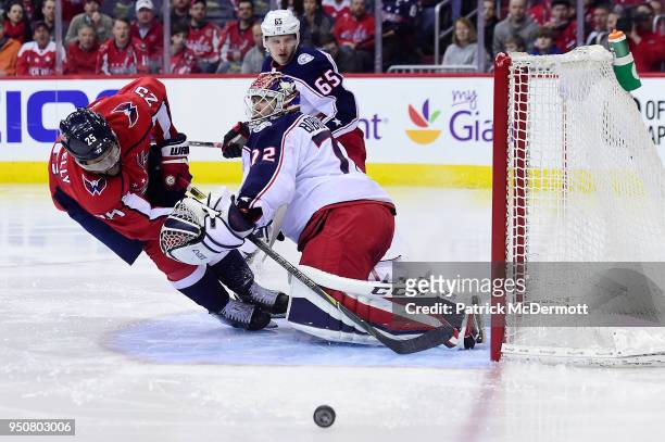 Devante Smith-Pelly of the Washington Capitals and Sergei Bobrovsky of the Columbus Blue Jackets collide in the third period in Game Five of the...