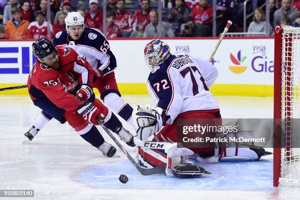 Devante Smith-Pelly of the Washington Capitals and Sergei Bobrovsky of the Columbus Blue Jackets collide in the third period in Game Five of the...