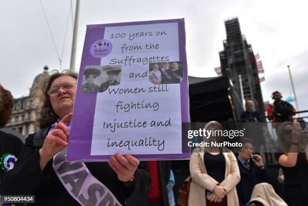 Suffragettes attend the official unveiling of a statue of suffragist and women's rights campaigner Millicent Fawcett in Parliament Square on April...